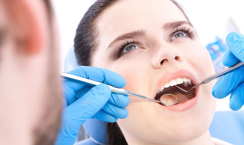 Thăm khám răng miệng định kỳ và cạo vôi răng thường xuyên